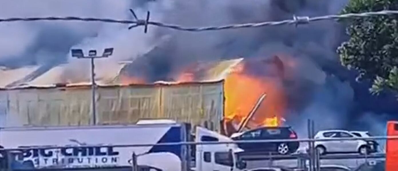 Fire rips through Auckland industrial site, sending smoke across sky