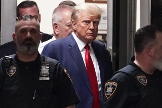  Former President Donald Trump is escorted to a courtroom, April 4, 2023, in New York. Trump’s bond has been set at $200,000 in the Georgia case accusing the former president of scheming to overturn his 2020 election loss. The bond agreement was outlined in a court filing signed by Fulton County District Attorney Fani Willis and Trump’s defense attorneys. (AP Photo/Mary Altaffer, File)