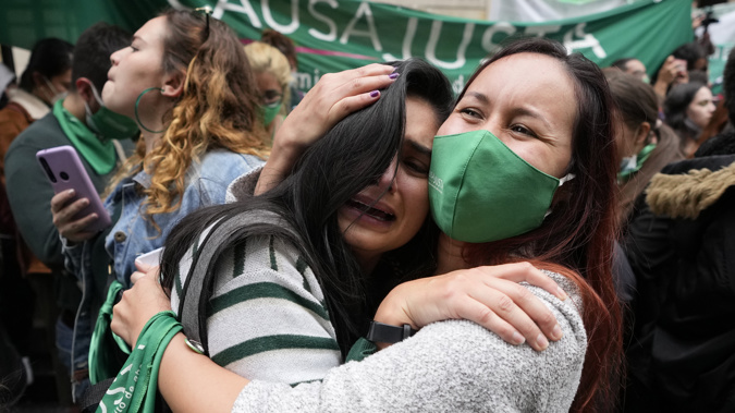 Abortion-rights activists celebrate after the Constitutional Court approved the decriminalization of abortion, lifting all limitations on the procedure until the 24th week of pregnancy, in Bogota, Colombia. (Photo / AP)