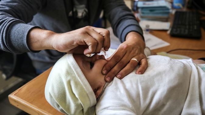 A UNRWA employee provides a Polio vaccine in a clinic in Deir al-Balah, central Gaza Strip, in January, 2024. Photo / Getty Images
