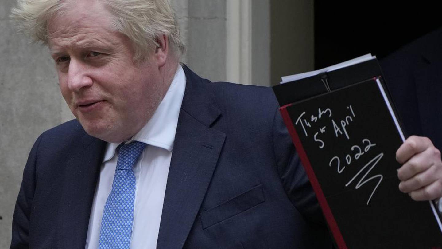 Britain's Prime Minister Boris Johnson waves to the media as he leaves 10 Downing Street for the House of Commons to make a statement about Downing Street parties. (Photo / AP)