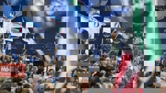 Right-wing party Brothers of Italy's leader Giorgia Meloni, centre-right on stage, addresses a rally as she starts her political campaign. Photo / AP