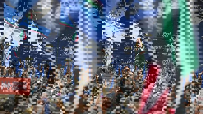 Right-wing party Brothers of Italy's leader Giorgia Meloni, centre-right on stage, addresses a rally as she starts her political campaign. Photo / AP