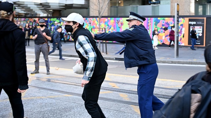 Police try to contain Blockade Australia protesters as they disrupt CBD traffic. (Photo / NCA NewsWire)