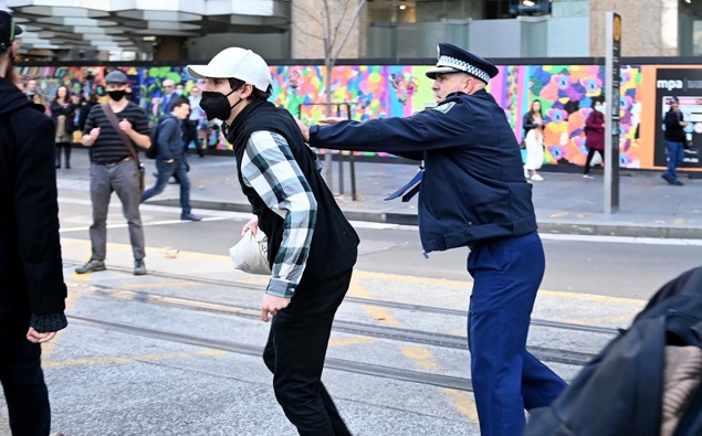 Police try to contain Blockade Australia protesters as they disrupt CBD traffic. (Photo / NCA NewsWire)