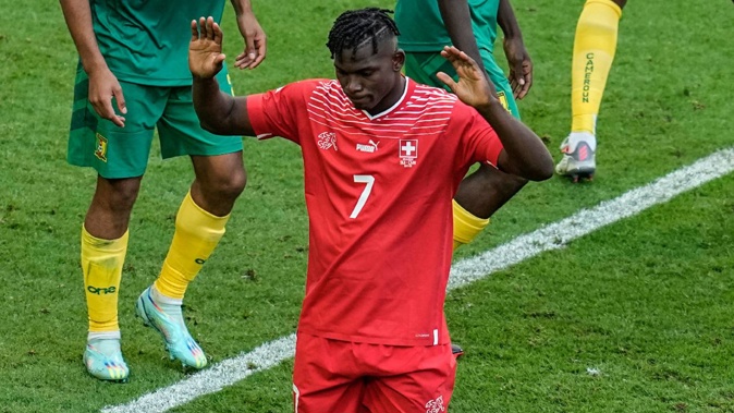 Switzerland's Breel Embolo holds his hands up after scoring against Cameroon. Photo / AP
