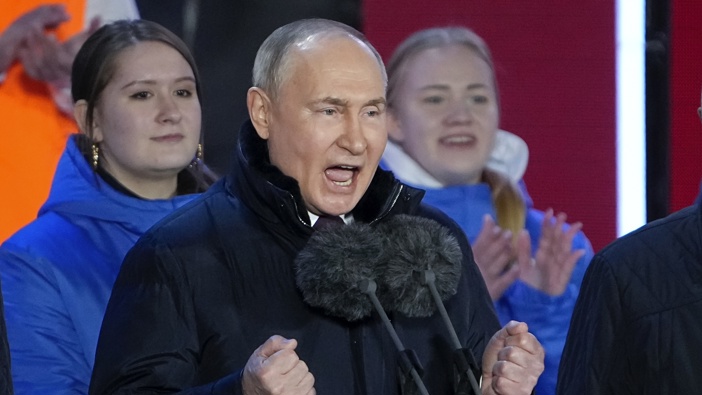 Russian President Vladimir Putin gestures while addressing a crowd at a concert marking his victory in a presidential election and the 10-year anniversary of Crimea's annexation by Russia on Red Square in Moscow, Russia, Monday, March 18, 2024. Photo / AP