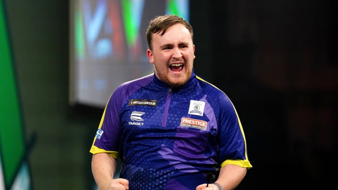 Luke Littler reacts during his match against Rob Cross during their World Darts Championship semifinal. Photo / Getty