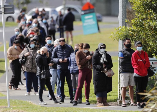 People lined up for a Covid-19 vaccination at the Westgate vaccination centre in Auckland. (Photo / Dean Purcell)