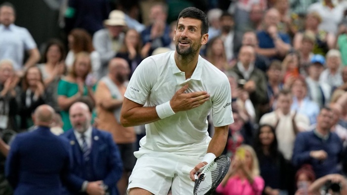 Novak Djokovic reacts after beating Jannik Sinner to win their men's singles semifinal match on day 12 of the Wimbledon tennis championships. Photo / AP