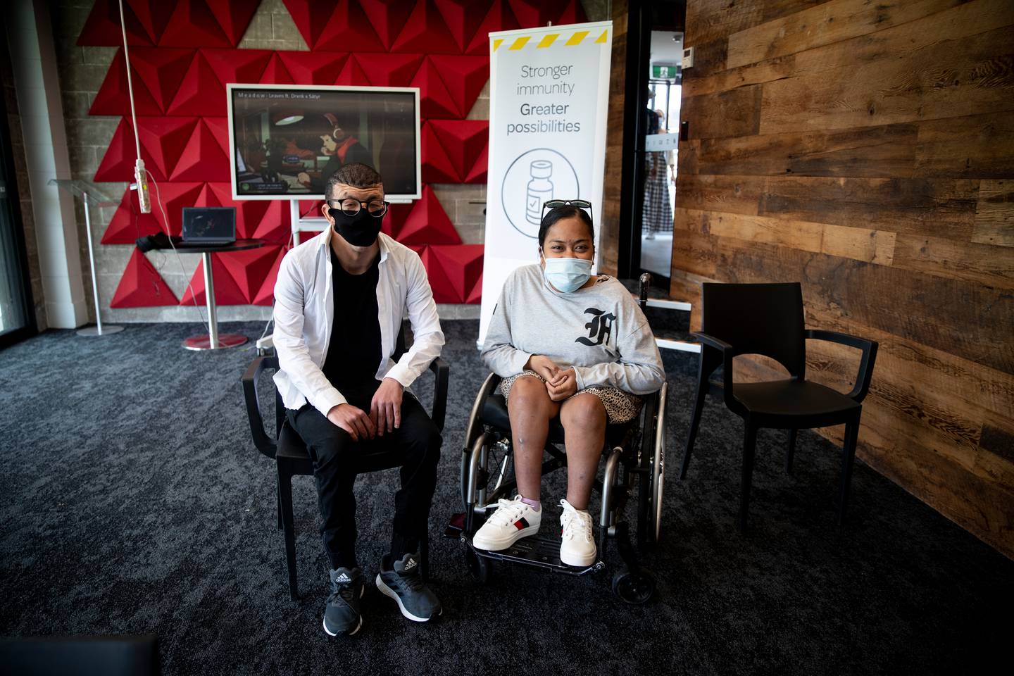 Abdulla Shiblaq and Lavinia Lovo are at the Disability Resource Centre in Takapuna to support students and disabled people during their Covid-19 vaccination. (Photo / Dean Purcell)