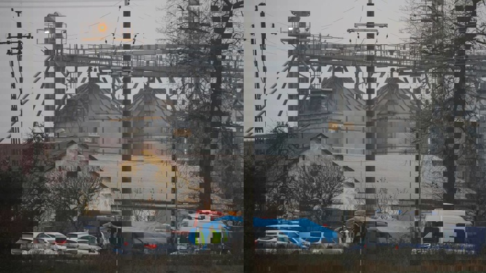 Police officers work outside a grain depot today where, according to the Polish government, an explosion of a Russian-made missile killed two people in Przewodow, Poland, yesterday. Photo / AP