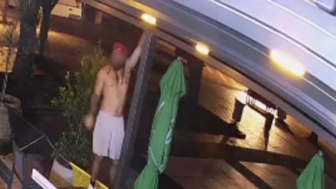 CCTV images show a bare-chested man holding on to the awning at Leo Molloy's bar headquarters at the Auckland Viaduct. Photo / CCTV Leo Molloy