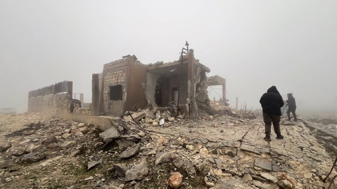 Syrians look at an abandoned medical facility in the village of Talteta, Syria on Tuesday, January 16, 2024, that was hit by Iranian missiles late on Monday night, according to a voluntary rescue group. Photo / AP