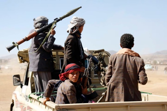 Houthi fighters and tribesmen stage a rally against the US and British strikes on Houthi-run military sites near Yemen. Photo / AP