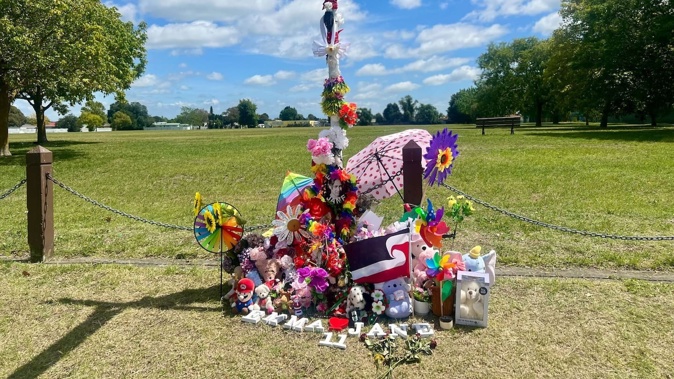 A tribute at the crash site as a 34-year-old woman is charged with manslaughter. Photo / Rafaella Melo