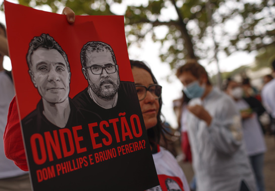 Brazilian actress Lucelia Santos takes holds a poster with the images of British journalist Dom Phillips, left, and expert on indigenous affairs Bruno Araujo Pereira following their disappearance in the Amazon, during a protest in Copacabana beach, Rio de Janeiro, Brazil. Photo / AP
