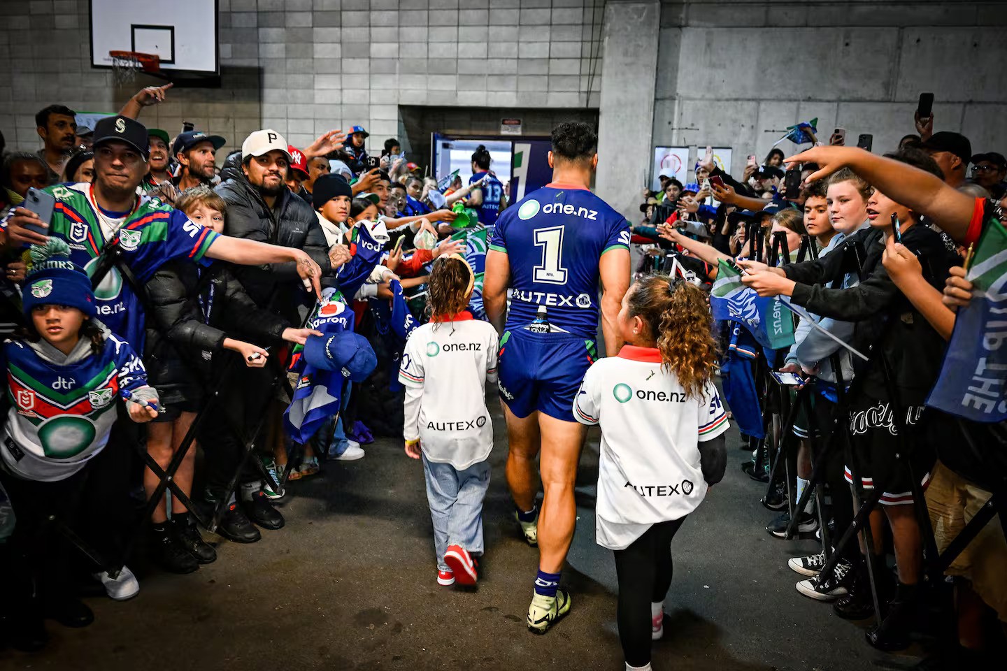 Roger Tuivasa-Sheck of the Warriors acknowledges fans as he leaves the field with his family. Photo / Photosport