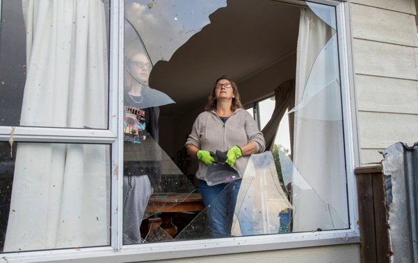 Moira Bryce and her son, Cormac, 21, in their house, damaged by a tornado on Aorangi Road, Paraparaumu. Photo / Mark Mitchell