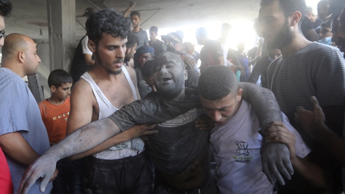 A Palestinian man reacts after being rescued from under the rubble of a destroyed building following an Israeli airstrike in Bureij refugee camp, Gaza Strip, Thursday, Nov. 2, 2023. Photo / AP