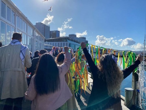 Survivors marching along Wellington's waterfront. Photo / Azaria Howell