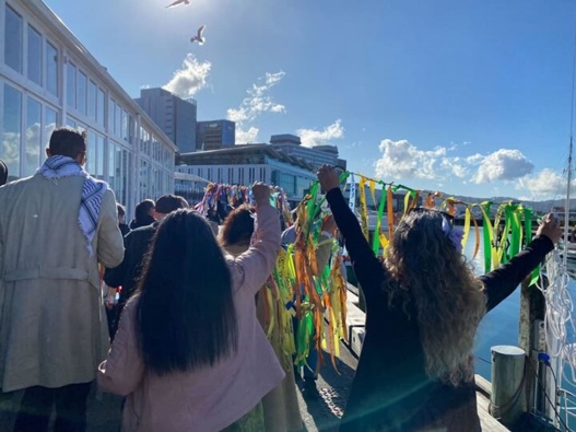 Survivors marching along Wellington's waterfront. Photo / Azaria Howell