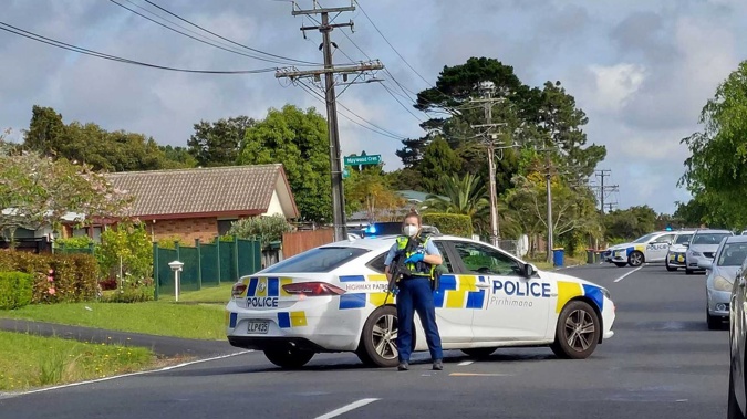 Armed police in Glen Eden following a shooting incident. (Photo / Dean Purcell)