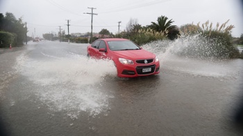 'Fortunate to be safe': Woman and children rescued from car 'engulfed' by flooding