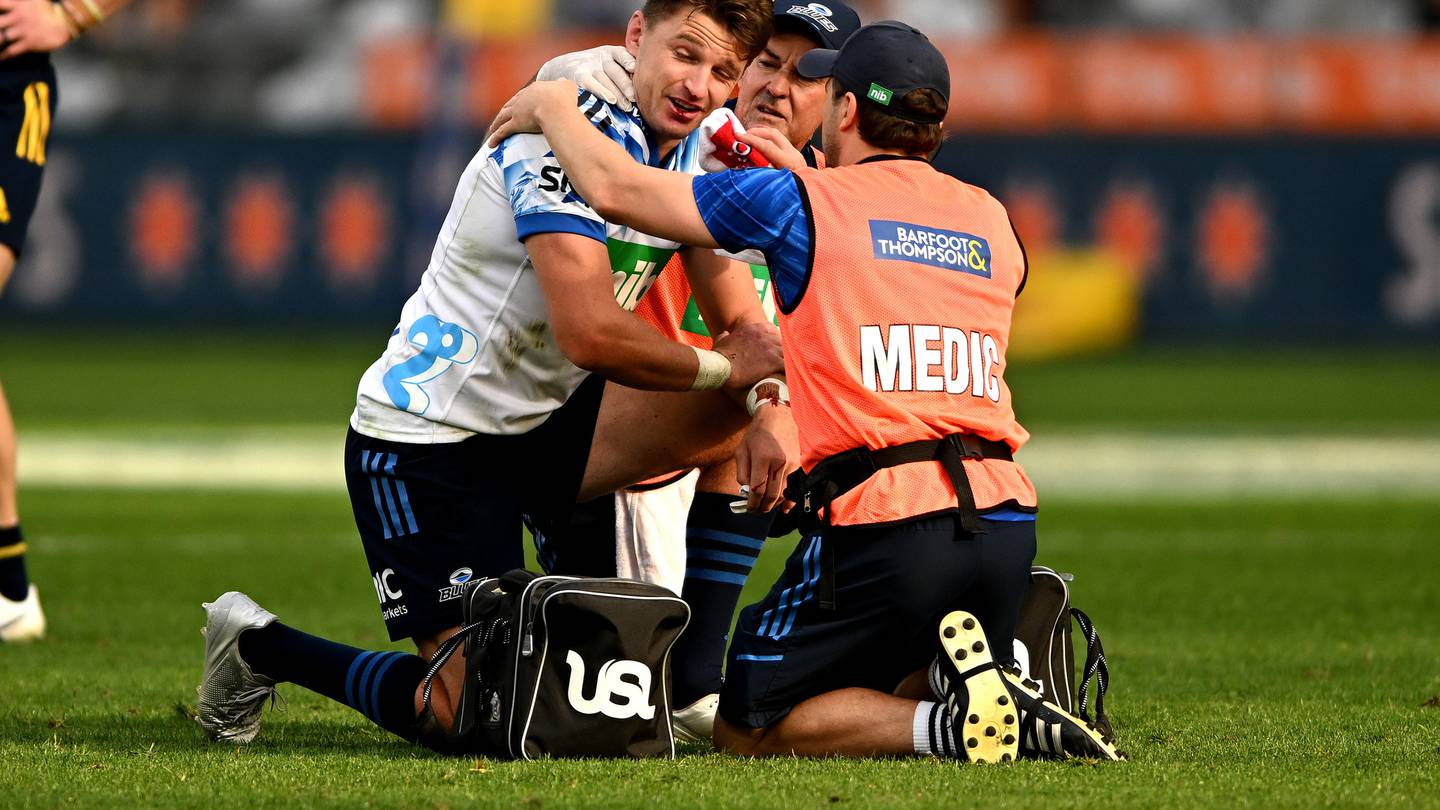 Beauden Barrett of the Blues receives medical attention after taking a knock to the head last night. Photo / Getty Images.