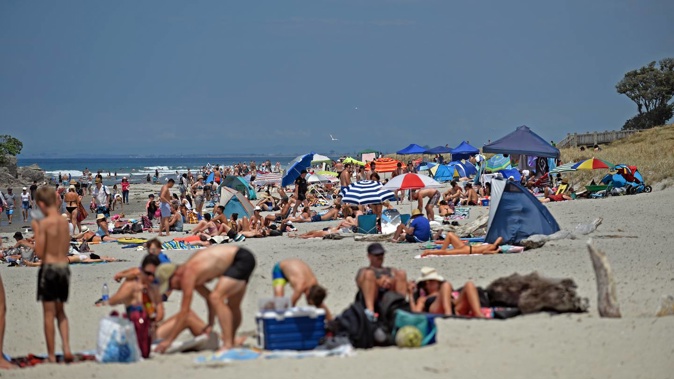 Mount Maunganui Main Beach packed with beachgoers. Photo / NZME