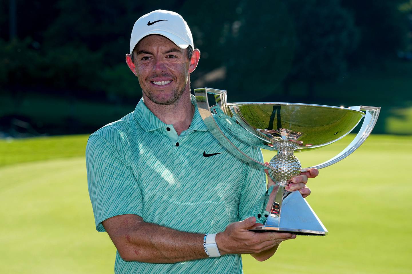 Rory McIlroy holds the trophy after winning the Tour Championship. Photo / AP