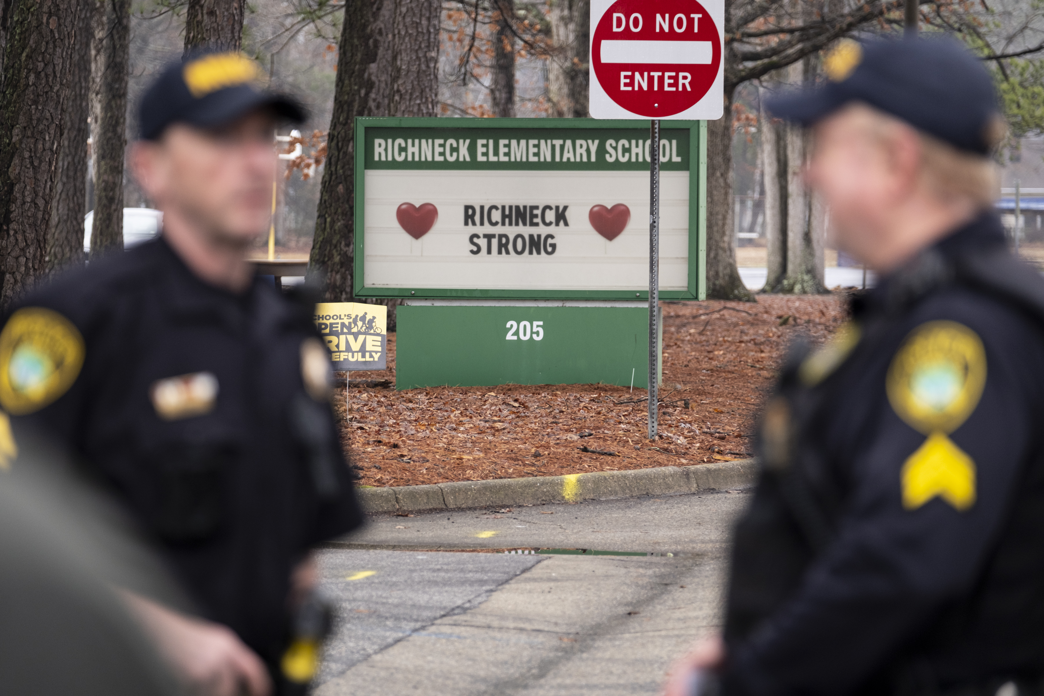 Police look on as students return to Richneck Elementary, Viginia. Photo / AP