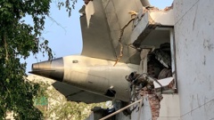 The back of Air India flight 171 is pictured at the site after it crashed in a residential area near the airport in Ahmedabad. Photo / Sam Panthaky, AFP