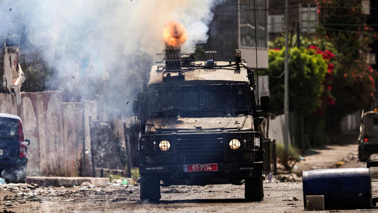 An Israeli armored vehicle fires tear gas during the military operation in Jenin in the occupied West Bank on July 4. Robaldo Schemidt/AFP/Getty Images
