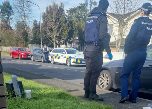 Police at the scene of an unexplained death in Henderson. Photo / Supplied
