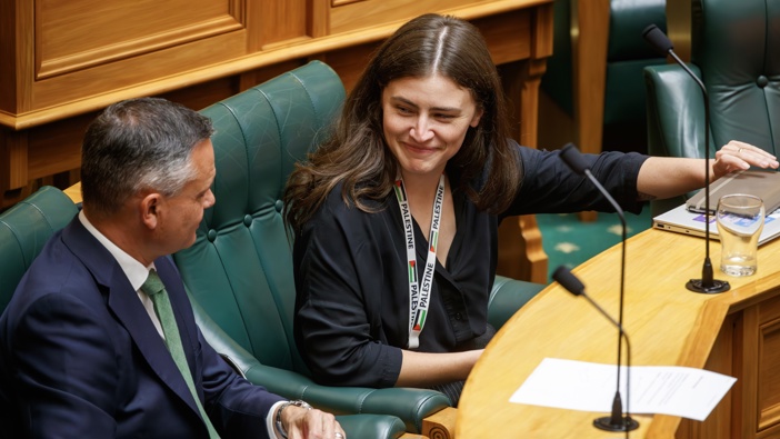Greens co-leader James Shaw sitting with MP Chloe Swarbrick in Parliament, Wellington, 30 January, 2024. Photo / Mark Mitchell