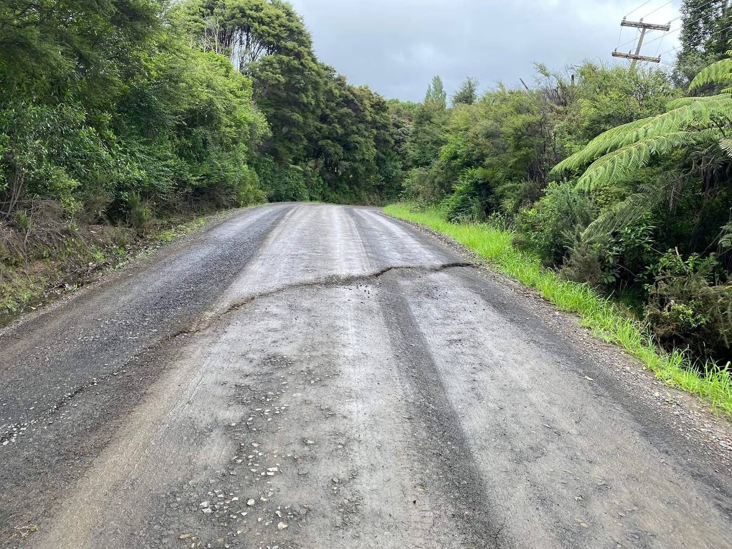 Commuters are advised to reduce speeds and trucks to delay travelling as an underground slip is forming on Kapowai Rd in Whenuakite. Photo / Thames-Coromandel District Council
