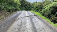Commuters are advised to reduce speeds and trucks to delay travelling as an underground slip is forming on Kapowai Rd in Whenuakite. Photo / Thames-Coromandel District Council