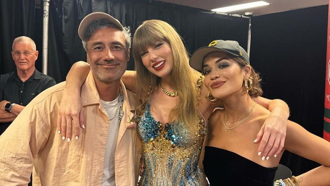 Taika Waititi and Rita Ora posing with Taylor Swift at her Sydney show. Photo / Instagram