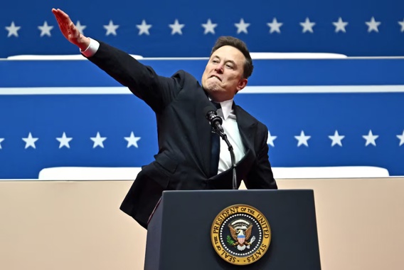 Tesla and SpaceX chief executive Elon Musk gestures as he speaks during the inaugural parade inside Capitol One Arena in Washington DC on January 20. Photo / AFP