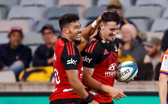 Will Jordan celebrates with Richie Mo'unga after scoring against the Brumbies. Photo / Photosport