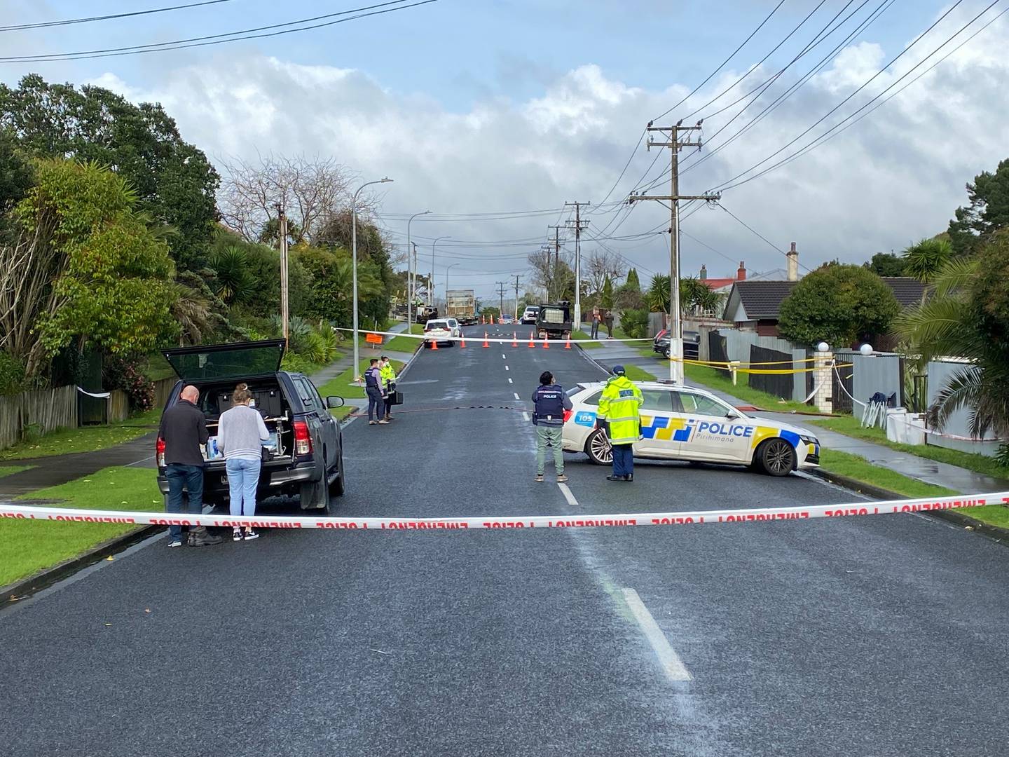 Police staff this morning at the scene of the fatal shooting of a woman last night Photo / Tom Dillane