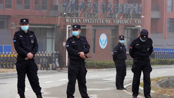 Security personnel outside the Wuhan Institute of Virology during a visit by the World Health Organisation team in February 2021. (Photo / AP)