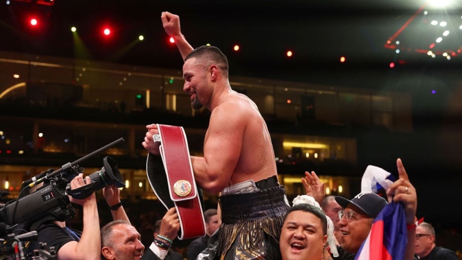 Joseph Parker celebrates victory with the title belt following the WBO Interim World Heavyweight title fight with Zhilei Zhang. Photo / Getty Images