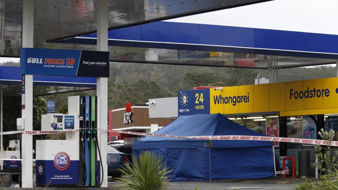 Police investigating the scene of last night's homicide at Gull service station in Raumanga. Photo / Michael Cunningham
