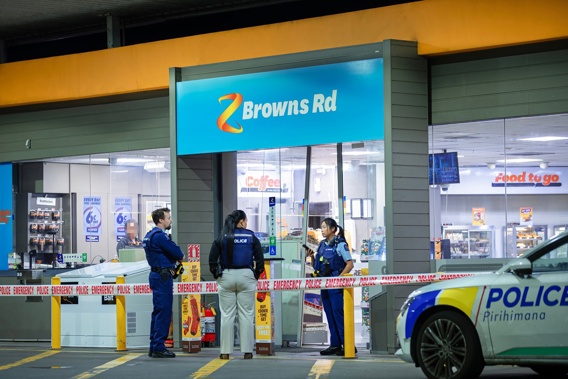 Police at the scene of an aggravated robbery at the Z service station on Roscommon Road in Manurewa. Photo / Hayden Woodward
