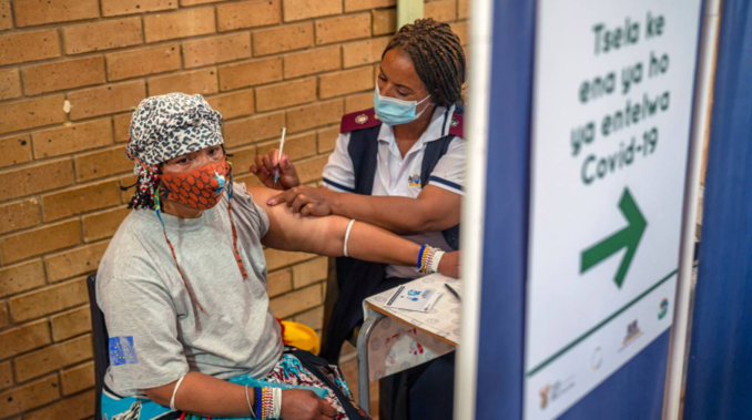 At a vaccination centre in South Africa, a resident receives her jab against Covid-19. (Photo / AP)