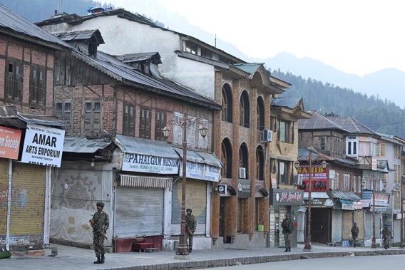 Indian paramilitary personnel conduct a patrol in Pahalgam, south of Srinagar, following an attack. Photo / AFP