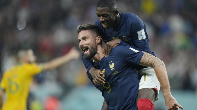 France's Olivier Giroud celebrates with his teammate Ousmane Dembele after scoring his side's second goal. Photo / AP