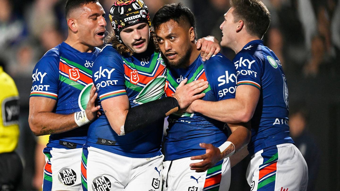 The Warriors celebrate a try to Adam Pompey. Photo / Photosport